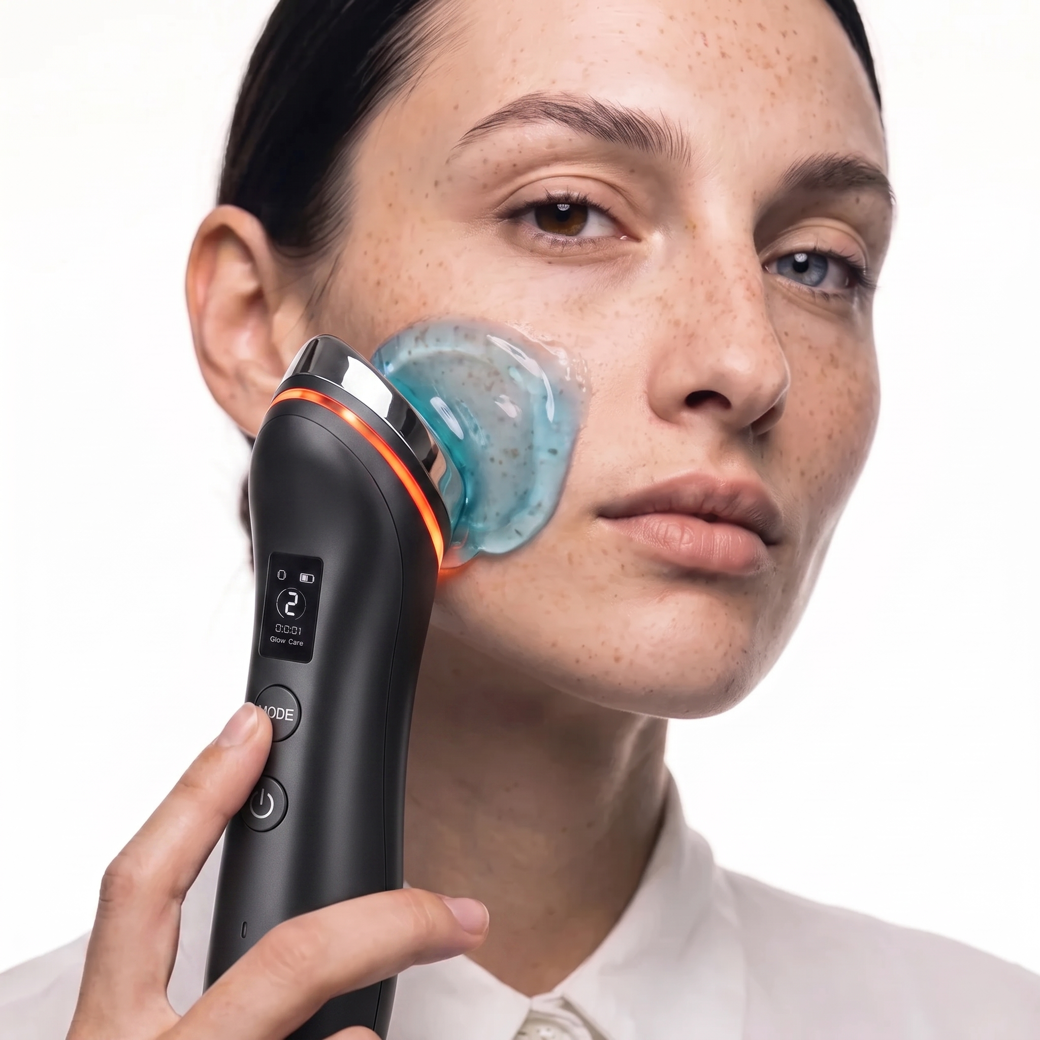 Velloura GlowBooster device gliding serum across the cheek